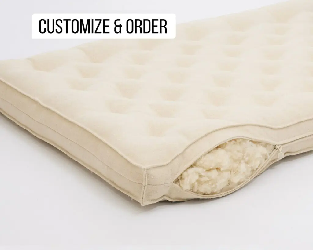 Home-of-Wool-organic-wool-filled-crib-mattresses---open-zipper-stuffing-detail