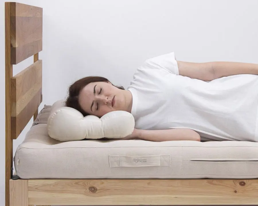 Home of Wool natural ergonomic wool pillow with model