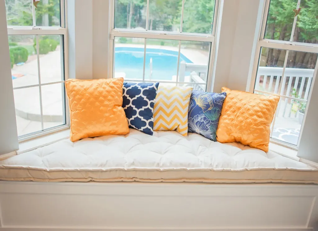 bay window nook with wool cushions and wool pillows
