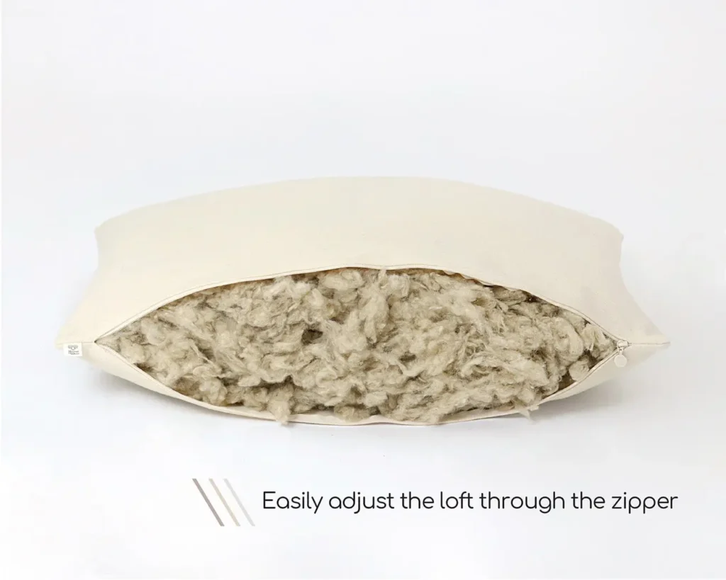 unzipped adjustable wool pillow revealing wool inside