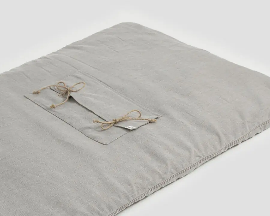sleeping bag with front pocket and ties