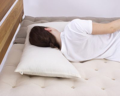 Home of Wool Side Sleeper Curved Pillow with model