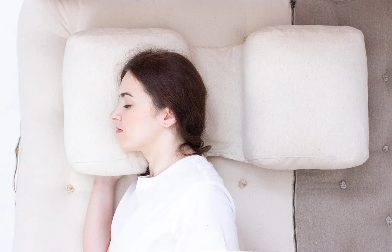 girl sleeping on home of wool back and side pillow