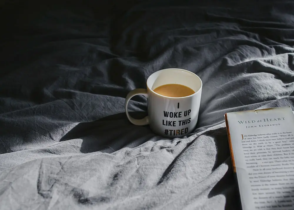 5 tips to beat chronic fatigue - coffee mug in bed