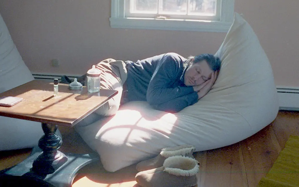 man sleeping on a home of wool bean bag