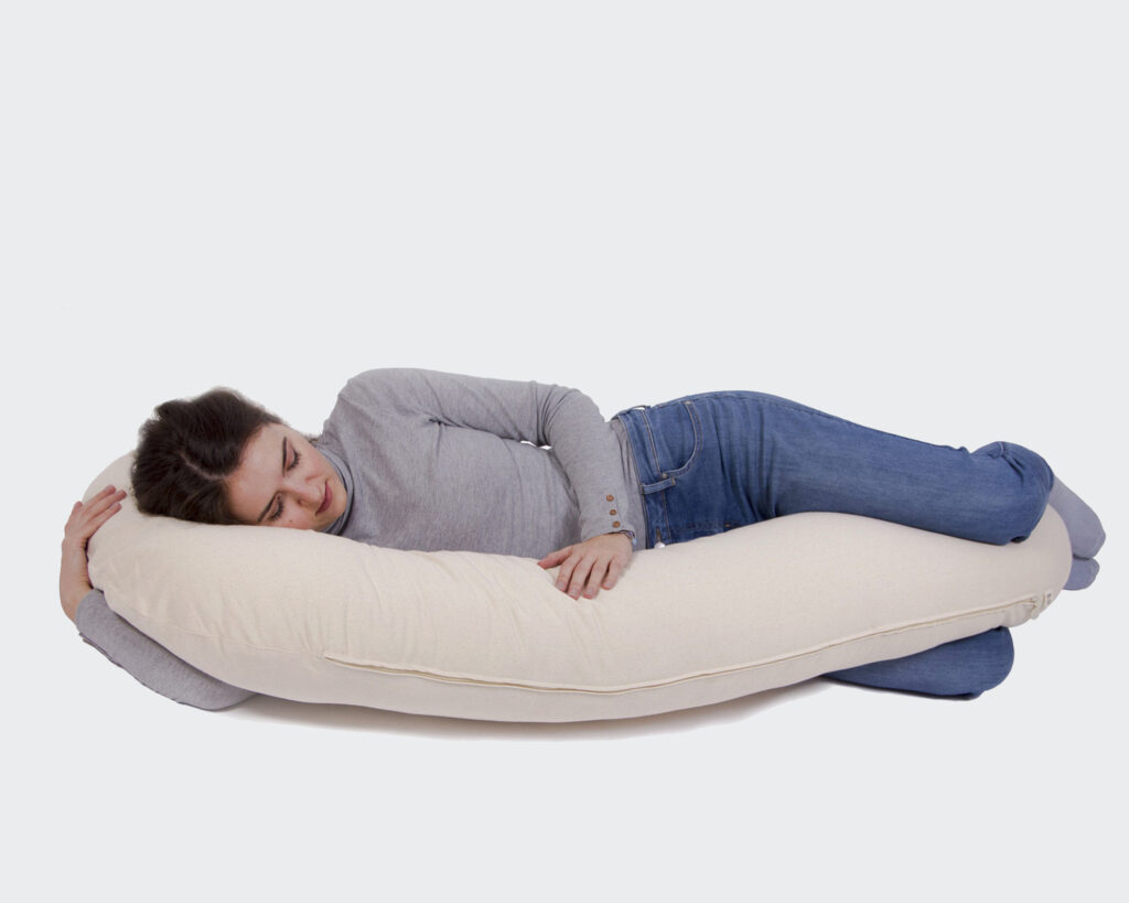 woman sleeping on organic home of wool pregnancy pillow