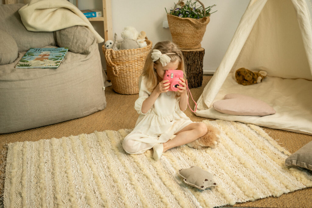 a child playing on a handwoven rug