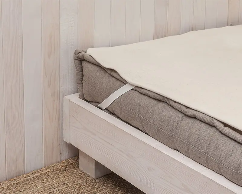 Protector de colchón de lana para una protección adicional.