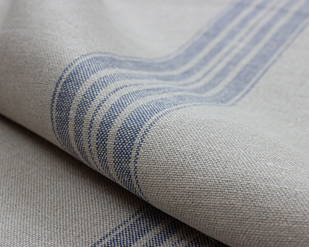 home of wool 100% linen blue stripes fabric folded
