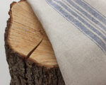 100% linen blue stripes on a tree stump close up