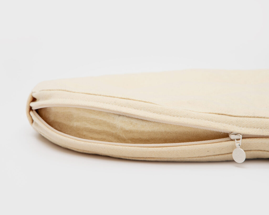 wool batting showing from a cushion