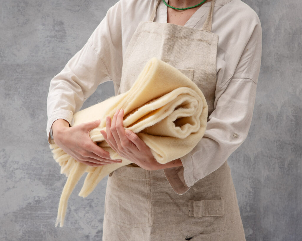 woman holding wool batting