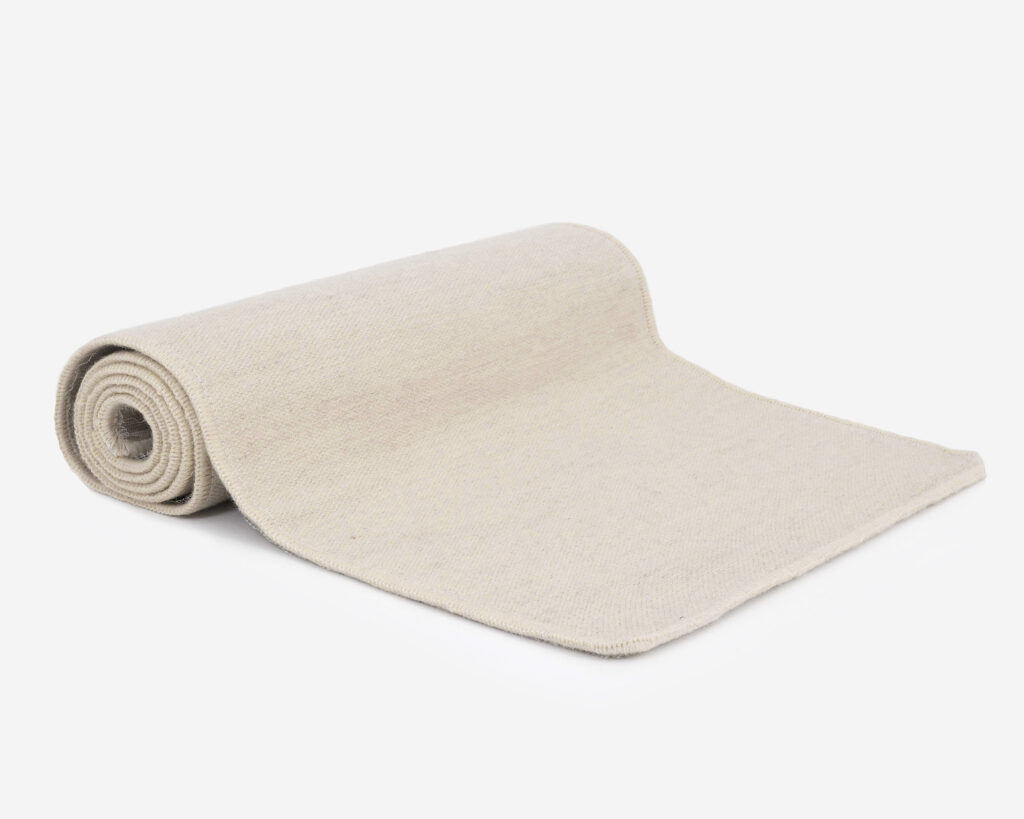 flat woven wool rug rolled up