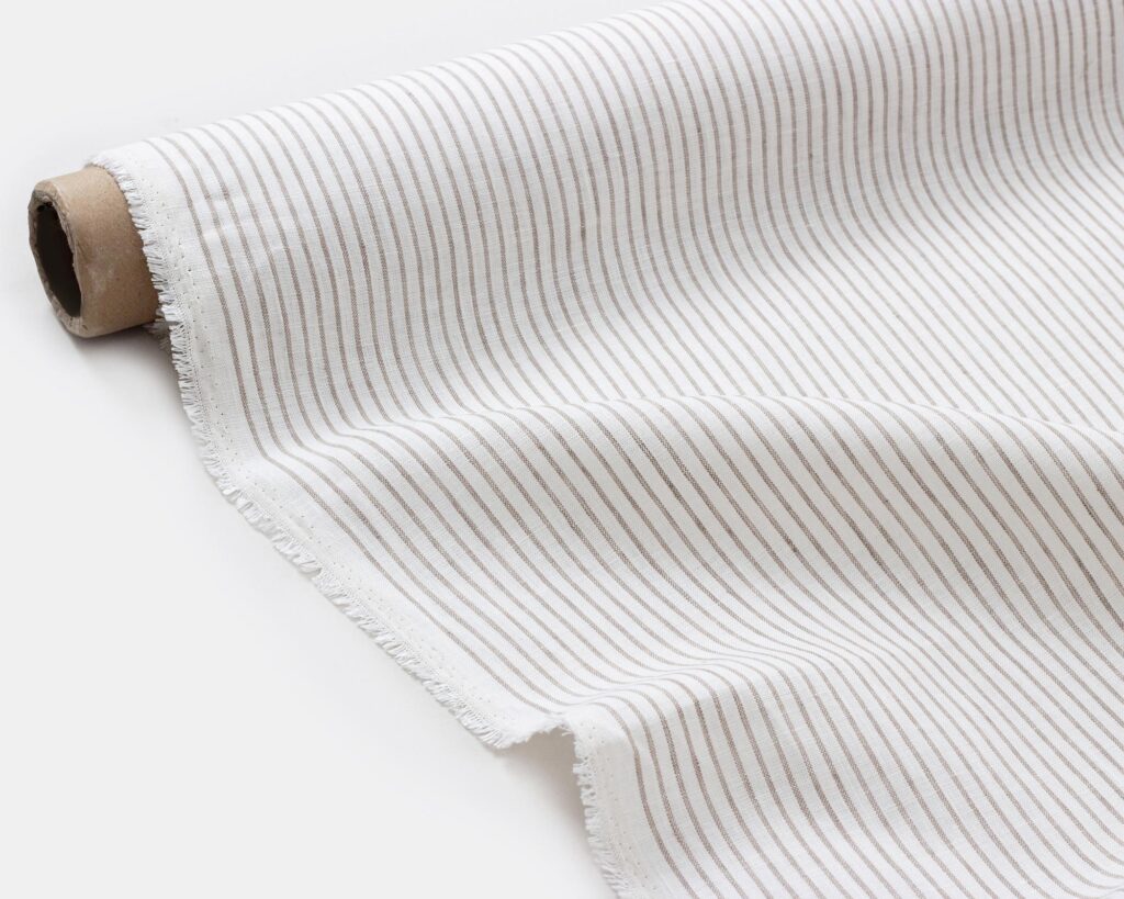 linen fabric with thin grey stripes folded out