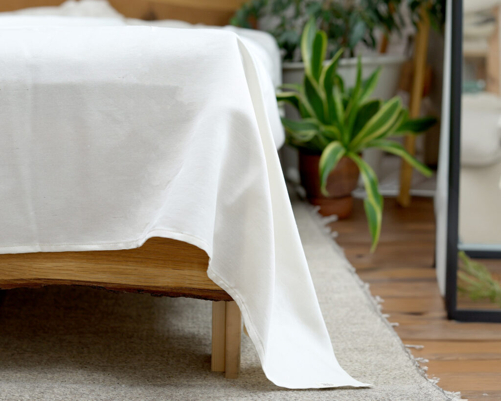 wool flat sheet on a bed