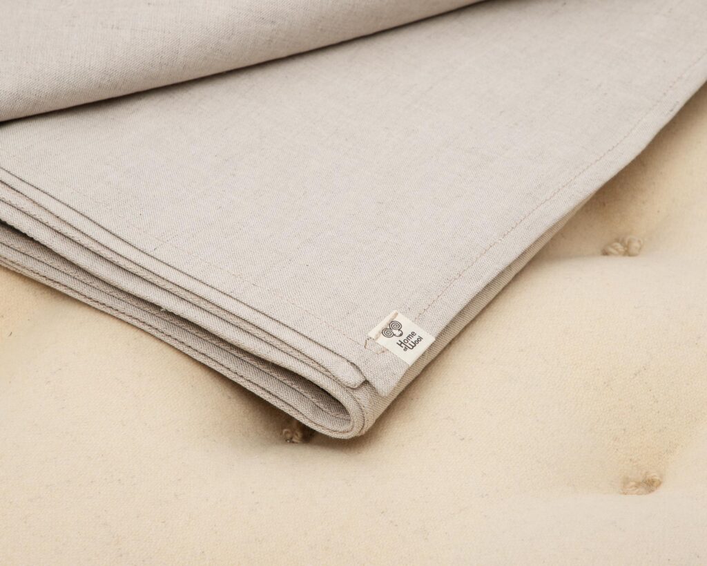 flat sheed folded showing home of wool logo