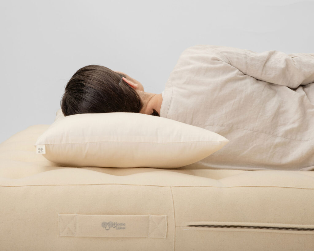 girl sleeping on home of wool side sleeper pillow