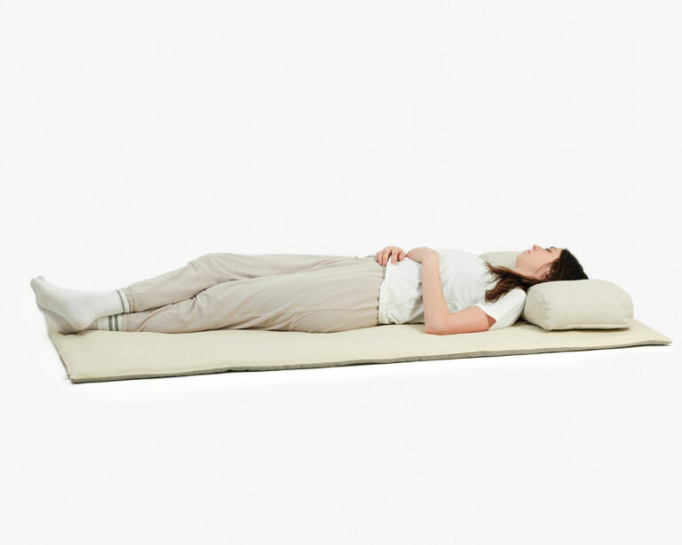 wool floor sleeping mat with a person sleeping on it