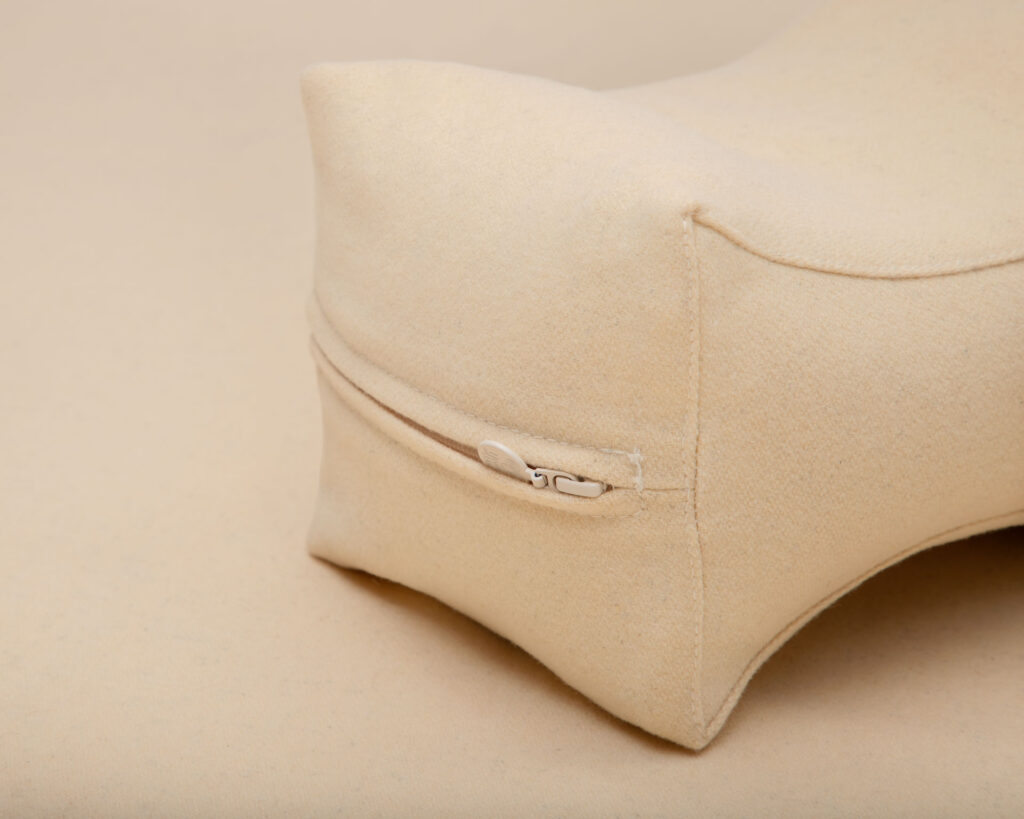 Wool knee pillow close up zipper