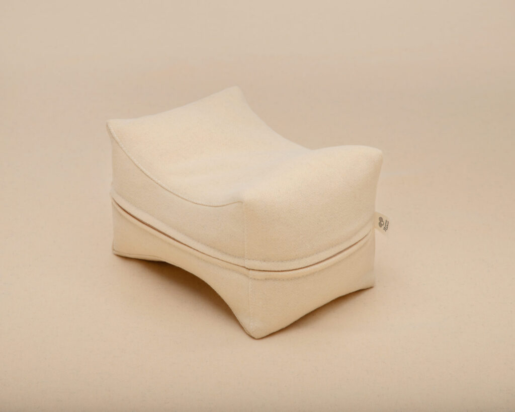 wool knee pillow side view