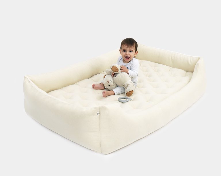 Wool montessori bed with a child in it