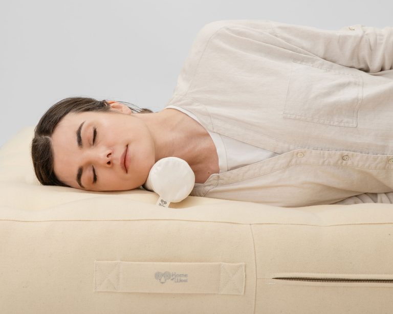 neck roll pillow with a woman using it