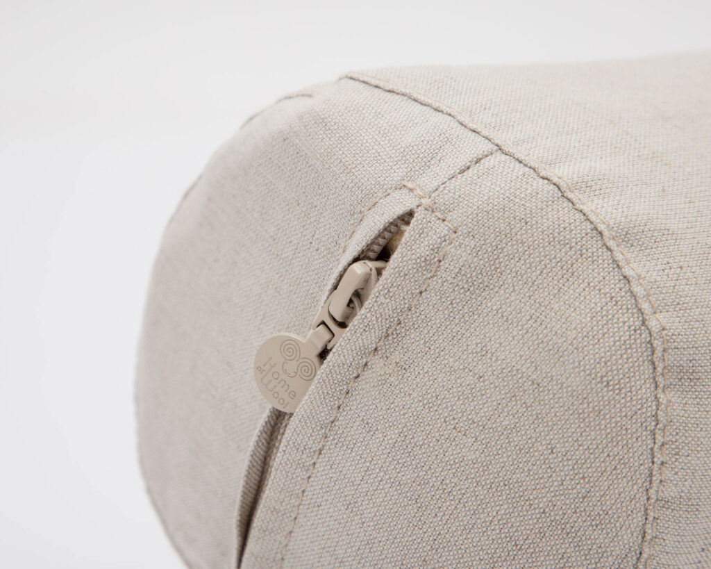 wool neck roll pillow close up with zipper