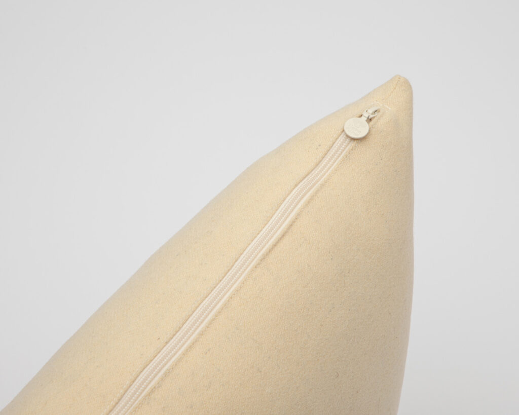 wool pillow protector on a pillow, showing the zipper