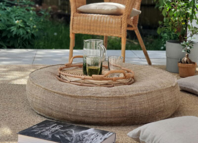 wool round cushion table in a garden setting