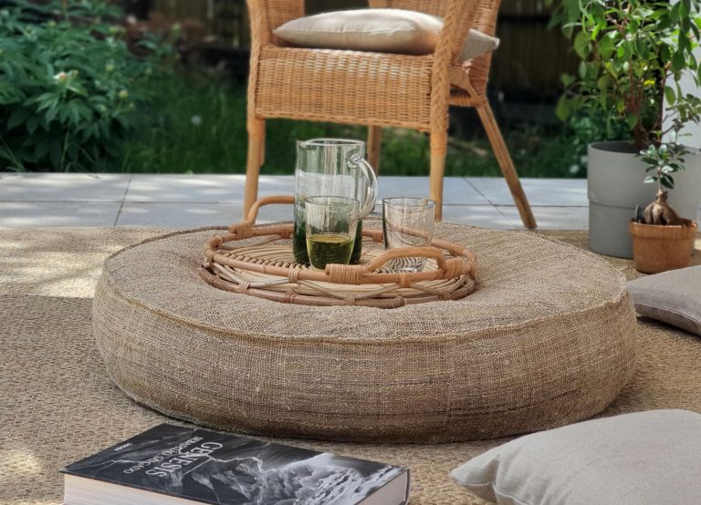 wool round cushion table in a garden setting