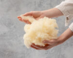 a handful of wool being held by a hand