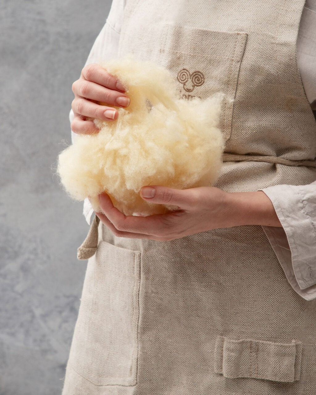 hanful of wool being held by someone