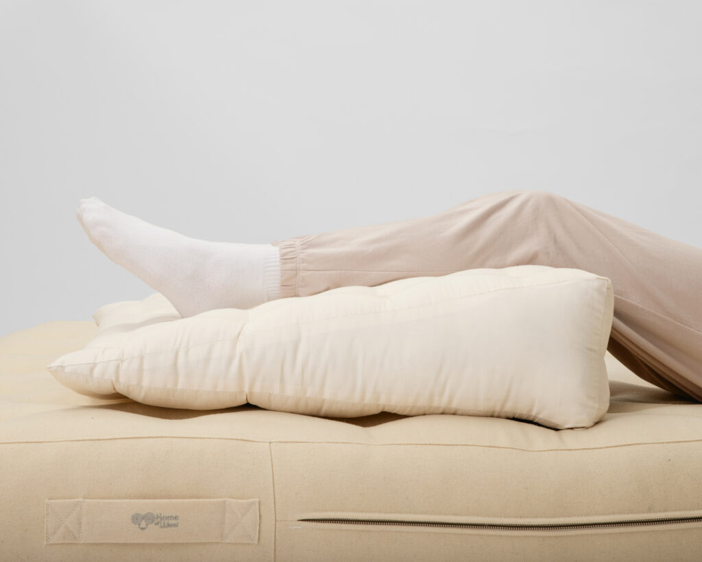 wool wedge pillow with elevated legs
